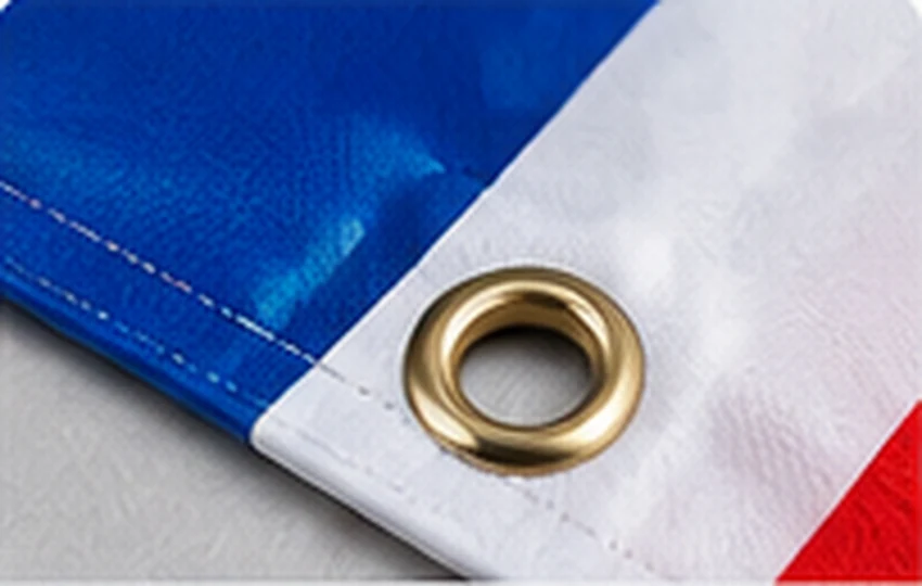 Illustrative close-up of PVC banner eyelet and hem