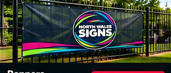 Promotional outdoor banner displayed on a fence